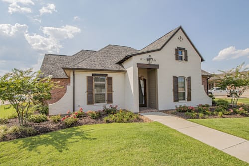 Exterior of a renovated white cottage-style residential home.